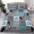 Hockey quilt bedding set styled in a bright bedroom with hockey players, pucks, sticks, and teal geometric patterns