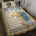 Christian quilt blanket displayed on a bed with wooden cross, blue flowers, butterflies, and faith-inspired wording