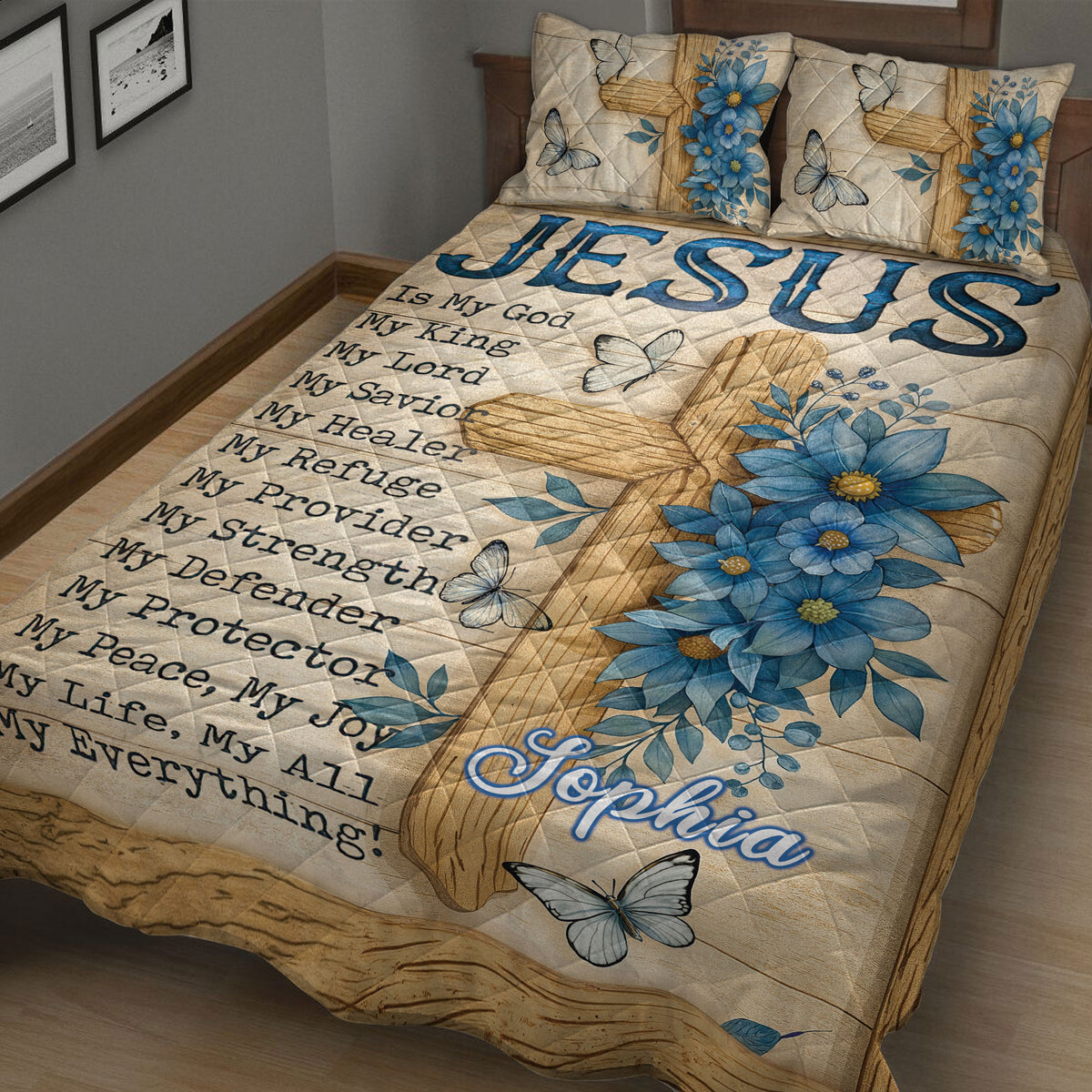 Close view of Christian quilt bedding with cross design, blue floral arrangement, butterflies, and inspirational faith text