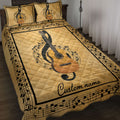 Gold guitar quilt blanket displayed on a bed with musical notes and a black music-themed border