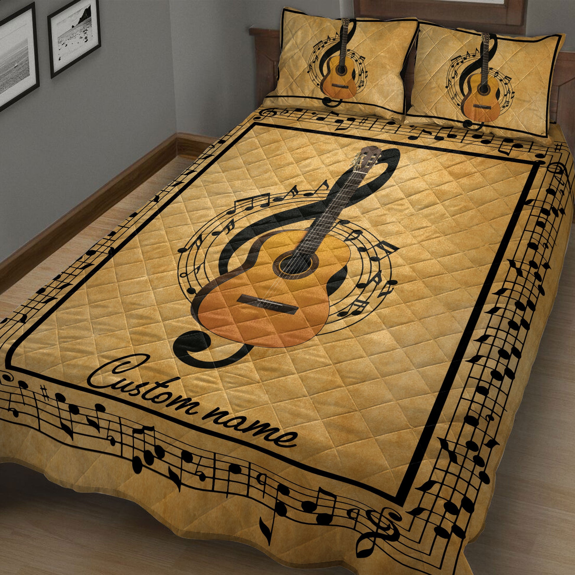 Close bedroom view of a gold guitar quilt blanket surrounded by musical notes and staff lines