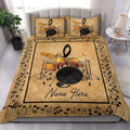 Drum set quilt bedding styled in a bright bedroom with gold musical artwork and printed pillows