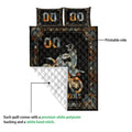 Motocross quilt showing a printed dirt bike rider design and white quilted reverse side