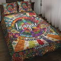 Colorful hippie quilt blanket with peace symbols, flowers, rainbow artwork, and bohemian bedroom design