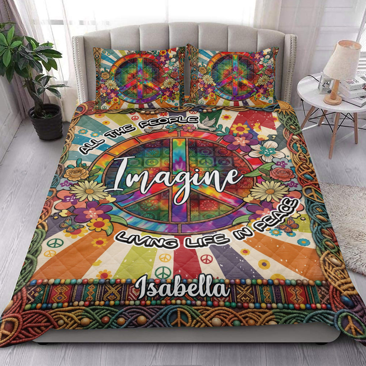 Hippie quilt bedding styled on a bed with rainbow peace symbols, flowers, and bohemian artwork