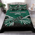 Cheerleading quilt bedding styled in a bright bedroom with green, black, and white pom-pom artwork