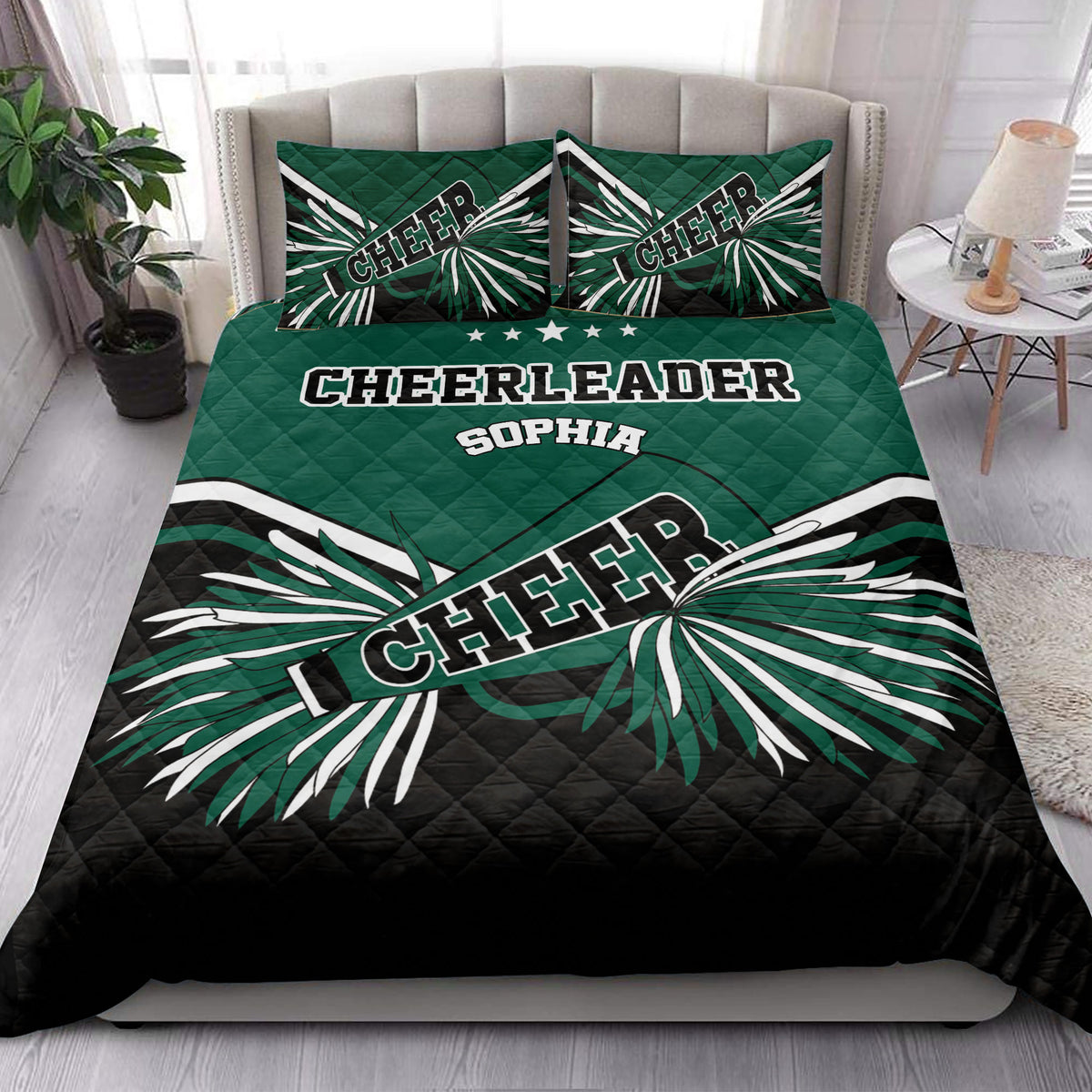 Cheerleading quilt bedding styled in a bright bedroom with green, black, and white pom-pom artwork