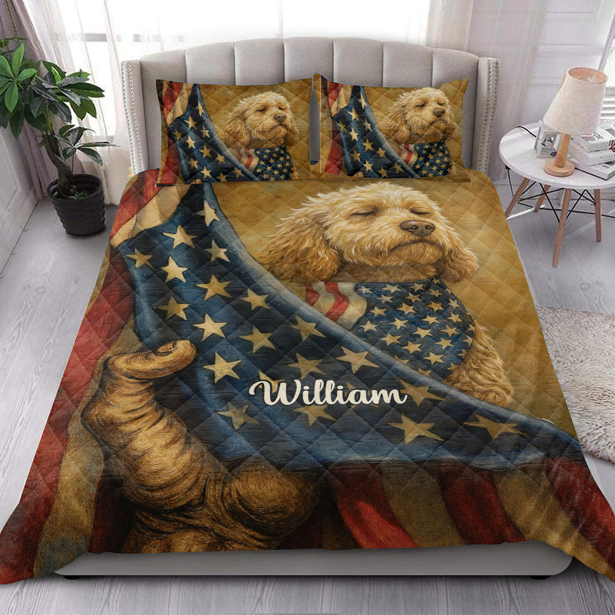 Patriotic Goldendoodle quilt blanket styled on a bedroom bed with matching dog artwork