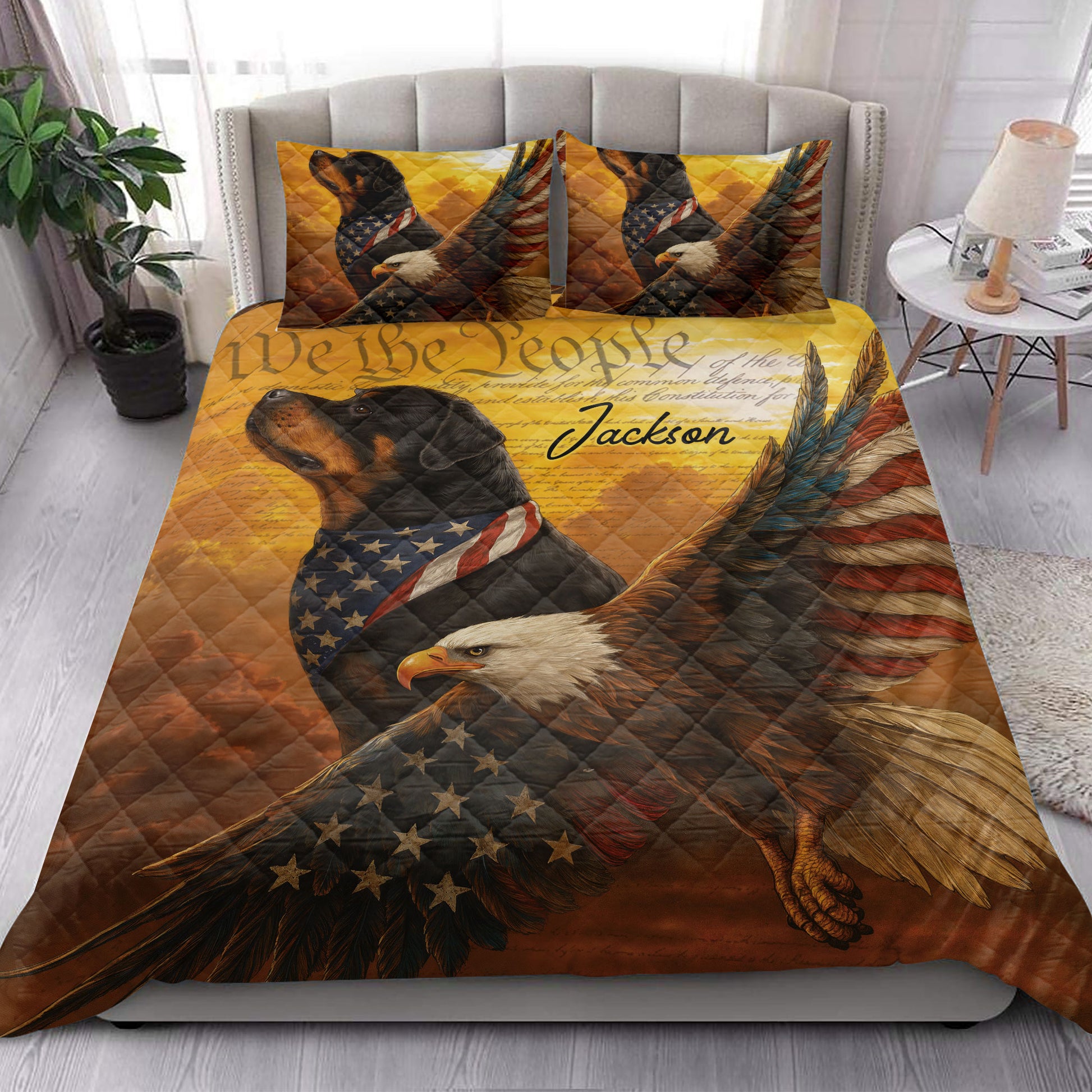 Patriotic Rottweiler and bald eagle quilt bedding styled in a bright bedroom