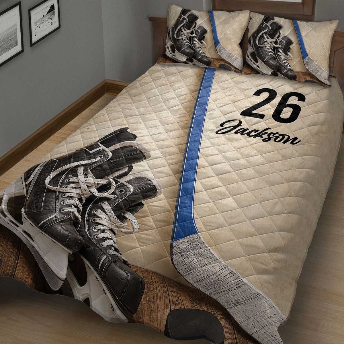 Close bedroom view of a hockey quilt blanket featuring skates, sticks, and bold sports artwork