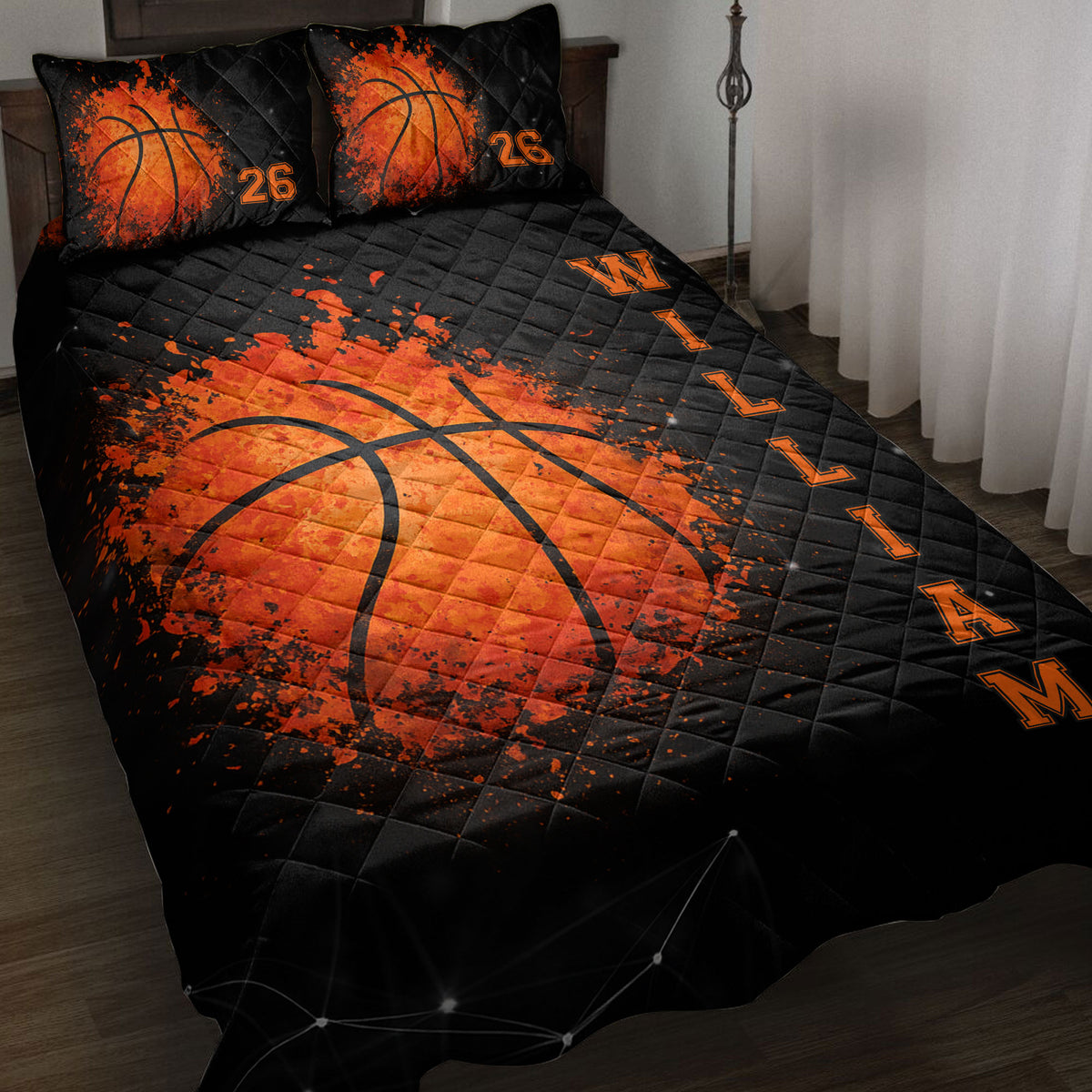Black and orange basketball quilt blanket bedding set displayed on a bed with matching basketball pillows