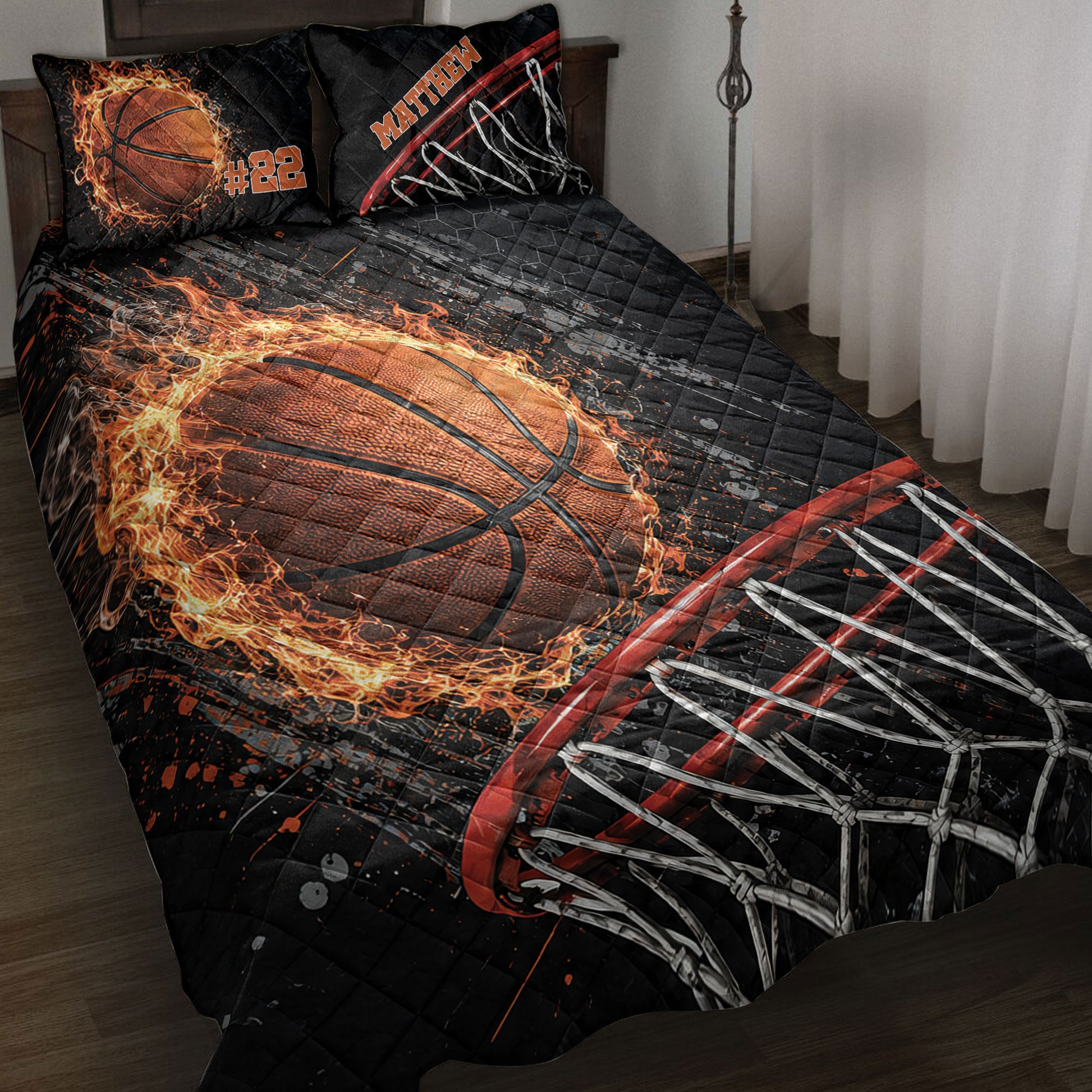 Basketball quilt blanket displayed on a bed with fiery orange basketball and hoop net artwork