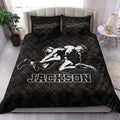 Wrestling quilt blanket styled in a bright bedroom with dramatic black and white grappling artwork
