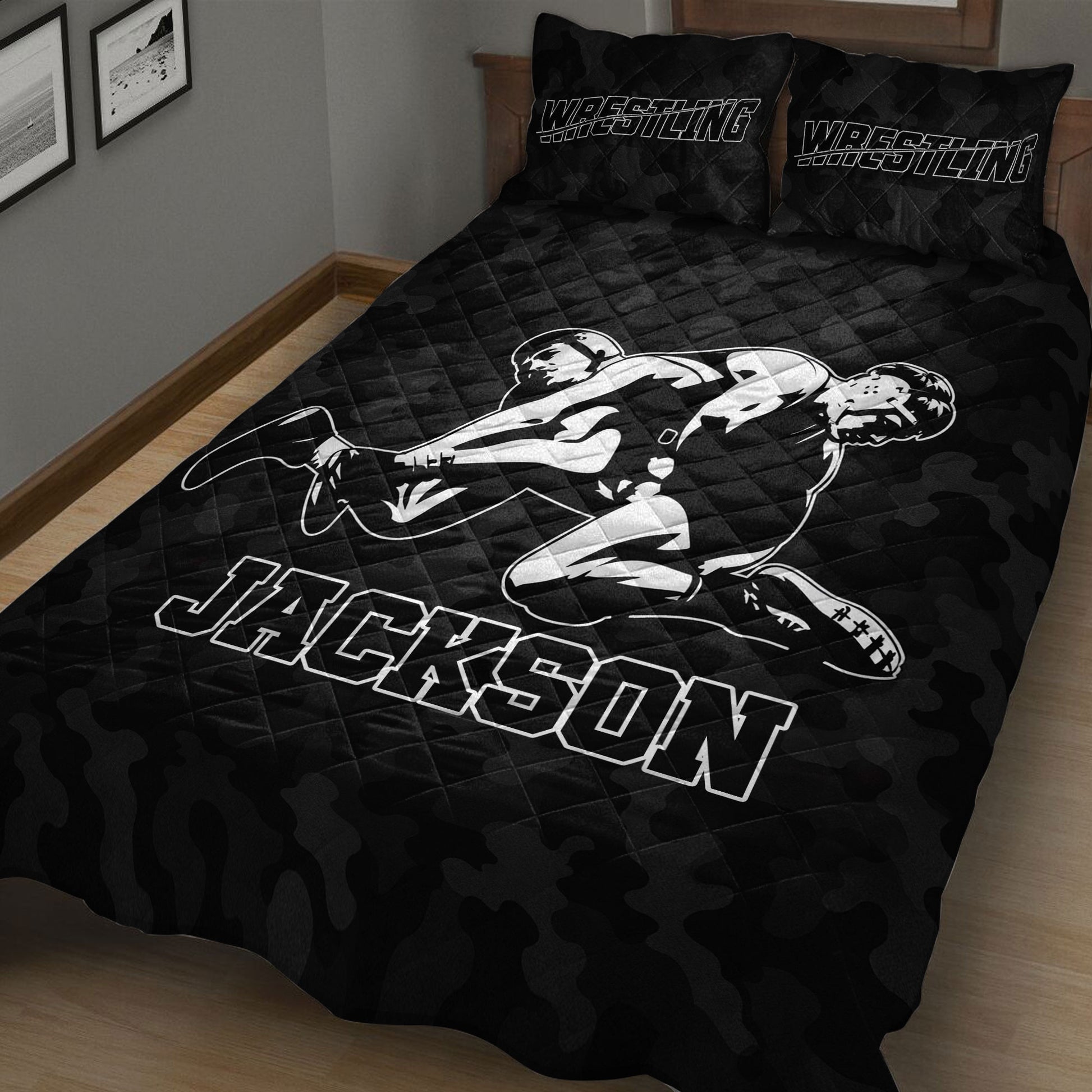 Black wrestling bedding set displayed on a wood floor with grappling athlete artwork and sports lettering