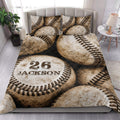Baseball quilt bedding styled on a modern bed in a bright bedroom with bold vintage sports artwork
