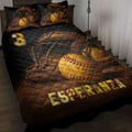Softball quilt blanket displayed on a bed with vintage gloves, yellow softballs, and black and gold sports artwork