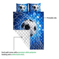 Close view of blue soccer quilt showing printed side and white quilted backing