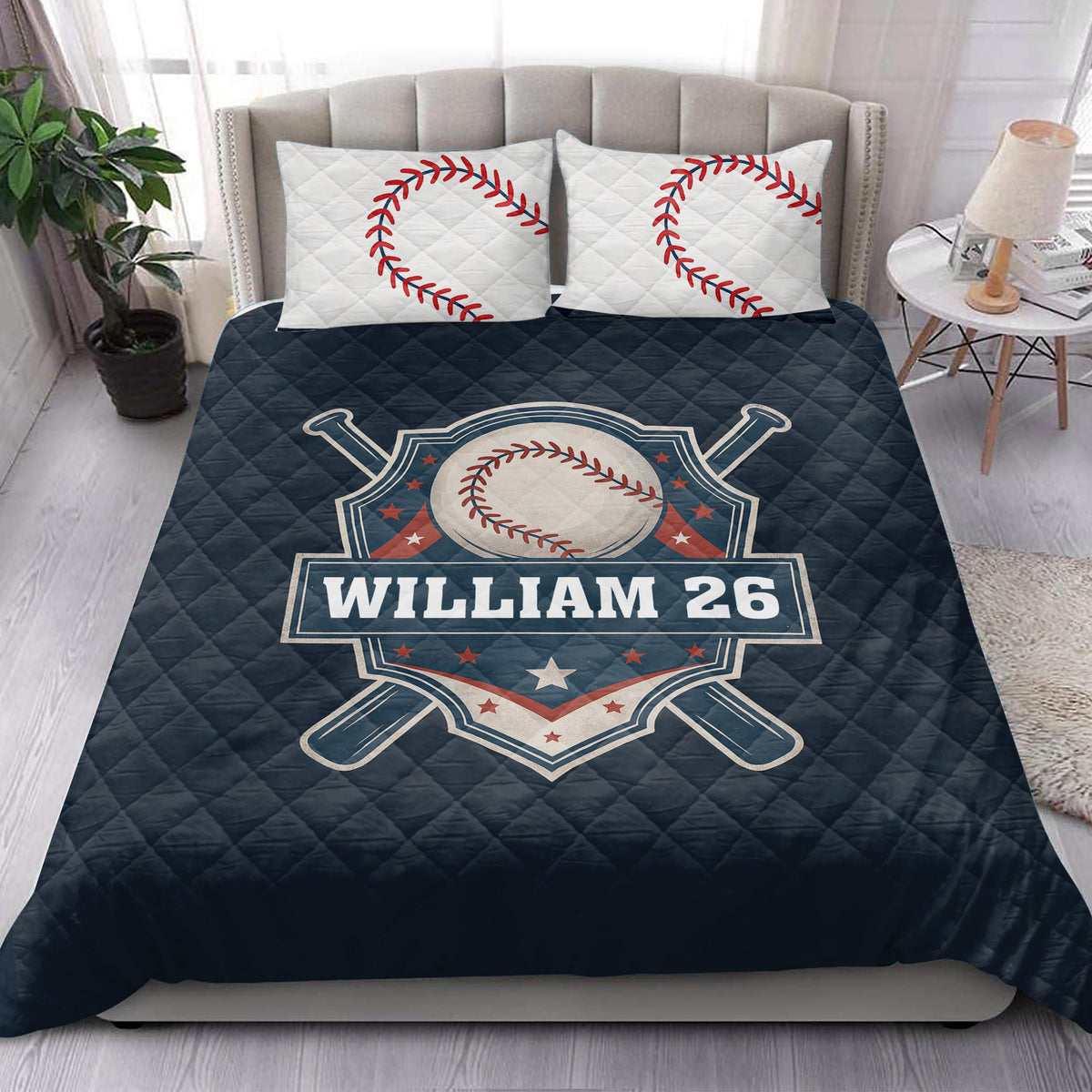 Baseball quilt blanket styled across a bedroom with baseball artwork and coordinating pillow designs