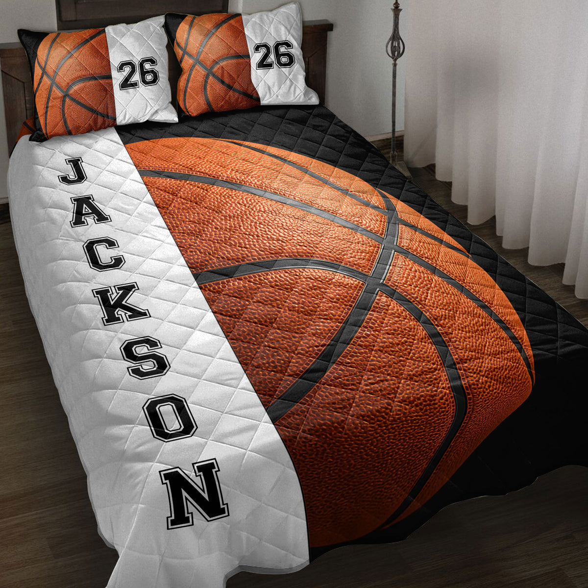 Basketball quilt blanket displayed on a bed with bold orange, black, and white sports artwork