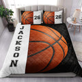 Basketball quilt blanket styled in a bright bedroom with coordinating sports artwork