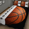 Close view of basketball quilt blanket featuring oversized orange basketball artwork