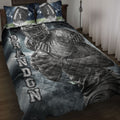 Football quilt blanket displayed on a bed with helmeted player artwork, stadium lights, and football-themed pillows