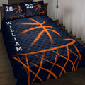 Navy basketball quilt blanket with bold orange basketball and hoop artwork displayed on a bed