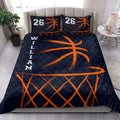 Basketball quilt bedding set styled in a bright bedroom with navy and orange sports artwork