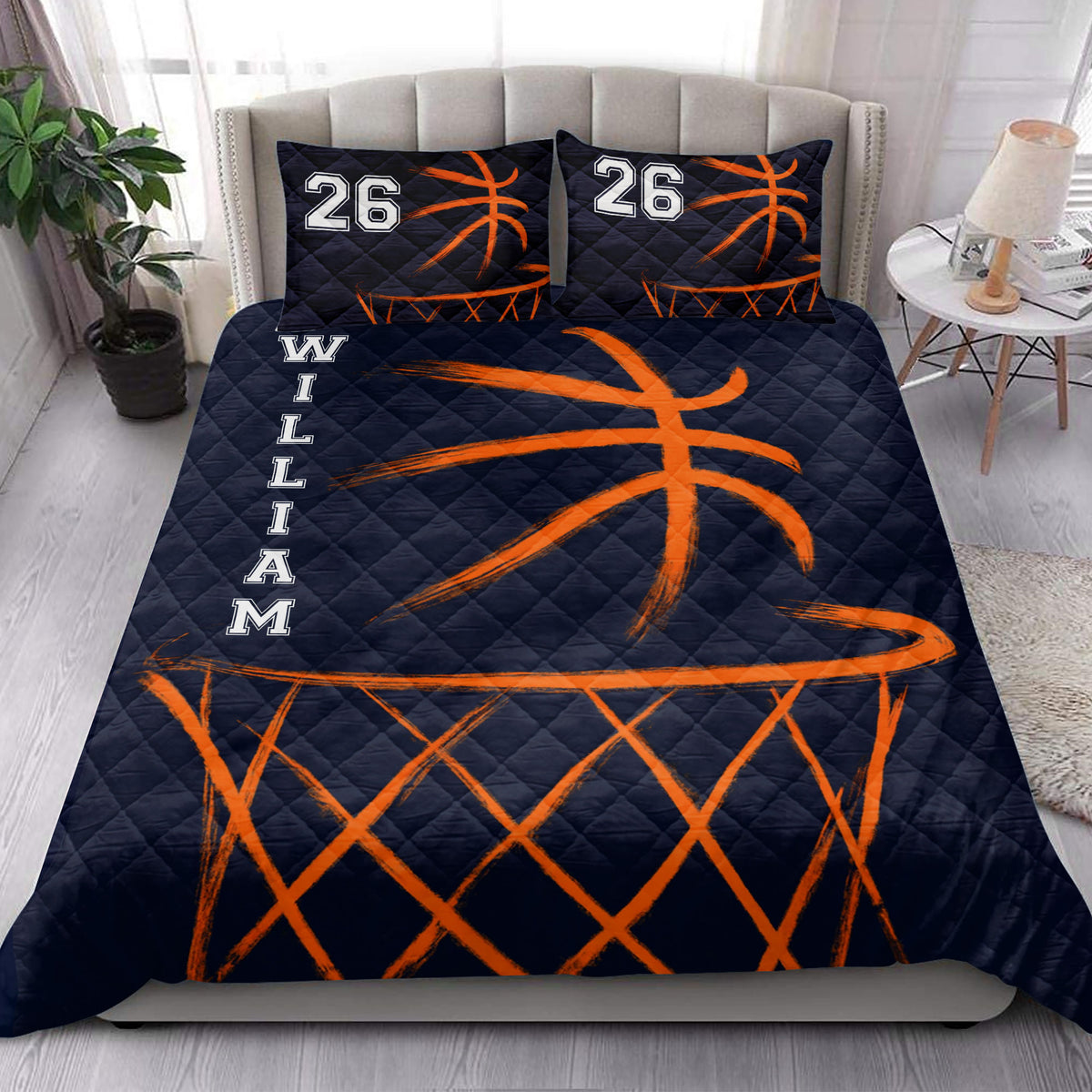 Basketball quilt bedding set styled in a bright bedroom with navy and orange sports artwork