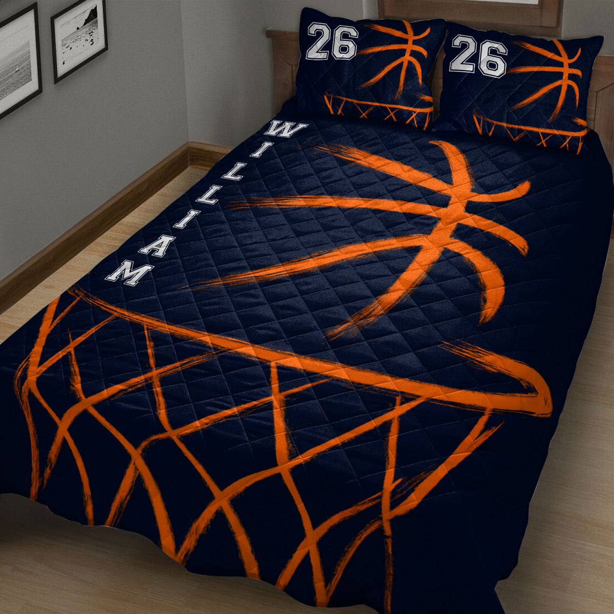 Angled bedroom view of a navy basketball quilt blanket with energetic orange court-inspired artwork
