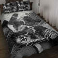 Hockey quilt blanket displayed on a bed with skates, sticks, pucks, and bold black and white sports artwork