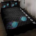 Black swimming quilt blanket displayed on a bed with colorful swim goggles and bold sports artwork