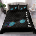 Swimming-themed black quilt blanket styled on a bedroom bed with colorful goggles and bold athletic artwork