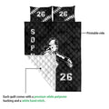 Softball quilt blanket shown with printed black front, white quilted backing, and stitched construction