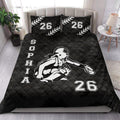 Black softball quilt bedding styled in a bedroom with female batter artwork and bold sports graphics