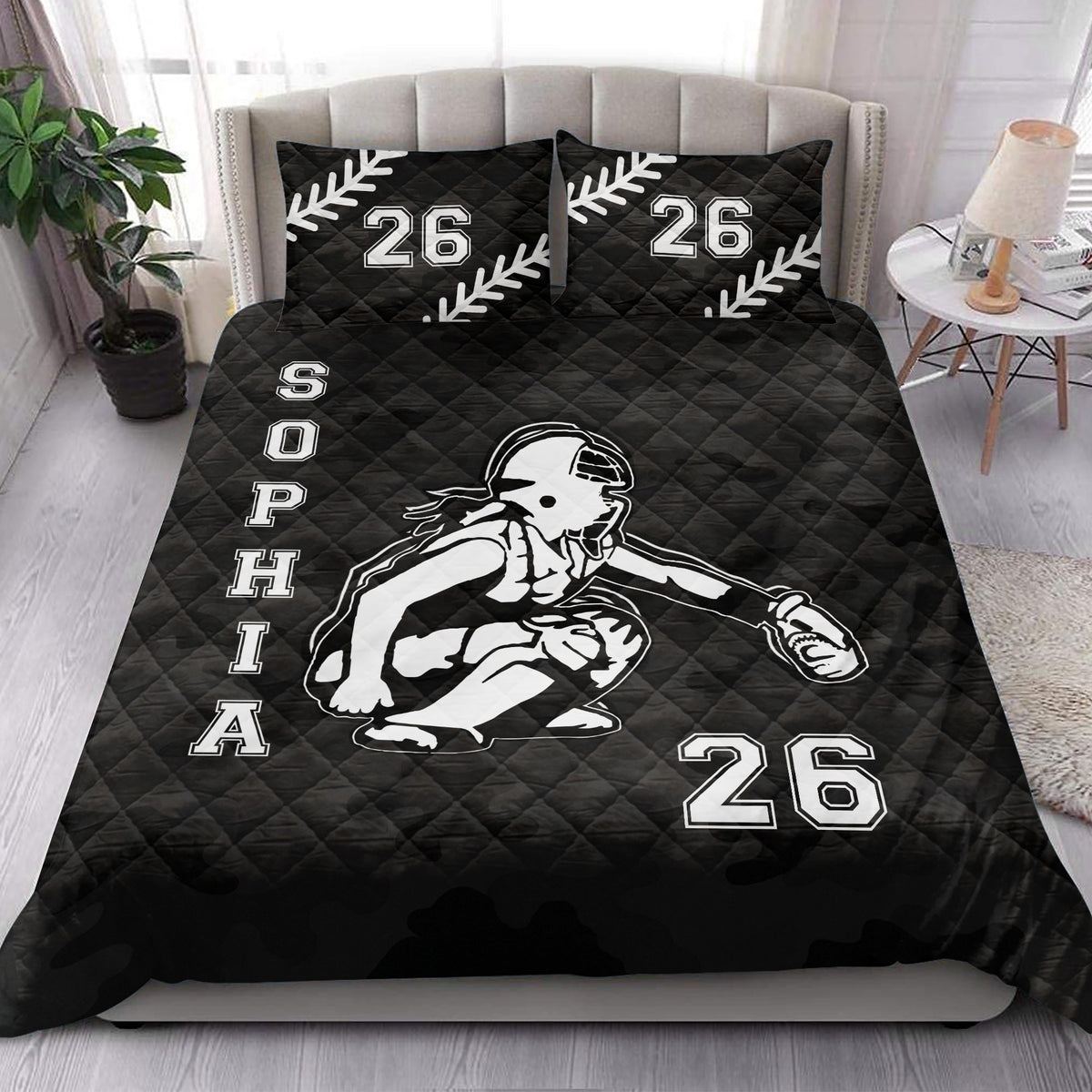 Black softball quilt bedding styled in a bedroom with female batter artwork and bold sports graphics