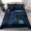 Basketball quilt bedding styled in a bright bedroom with blue player artwork