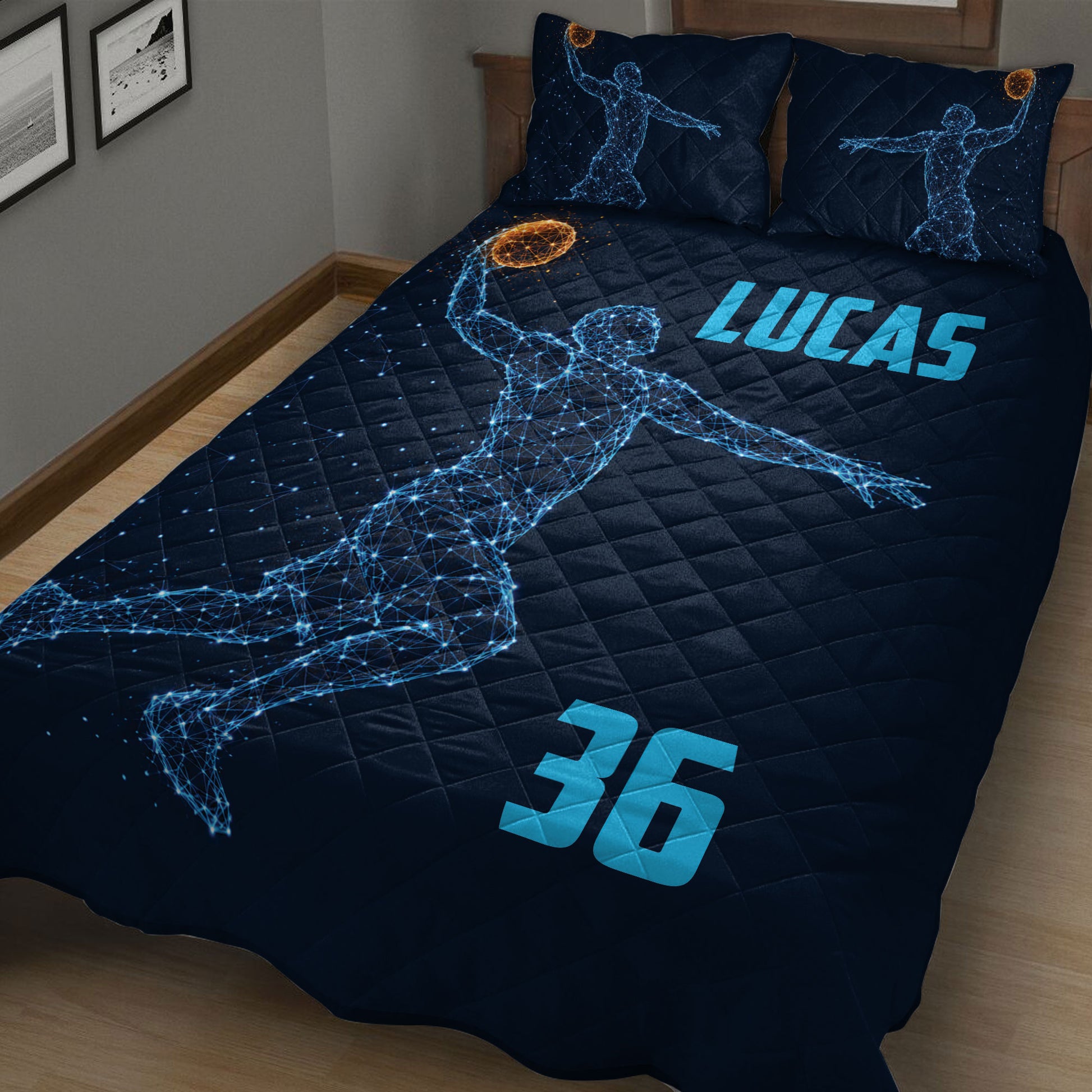 Navy basketball quilt blanket displayed on a bed with glowing sports artwork
