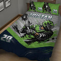 Close bedroom view of a lacrosse quilt blanket featuring a helmeted player and lacrosse sticks