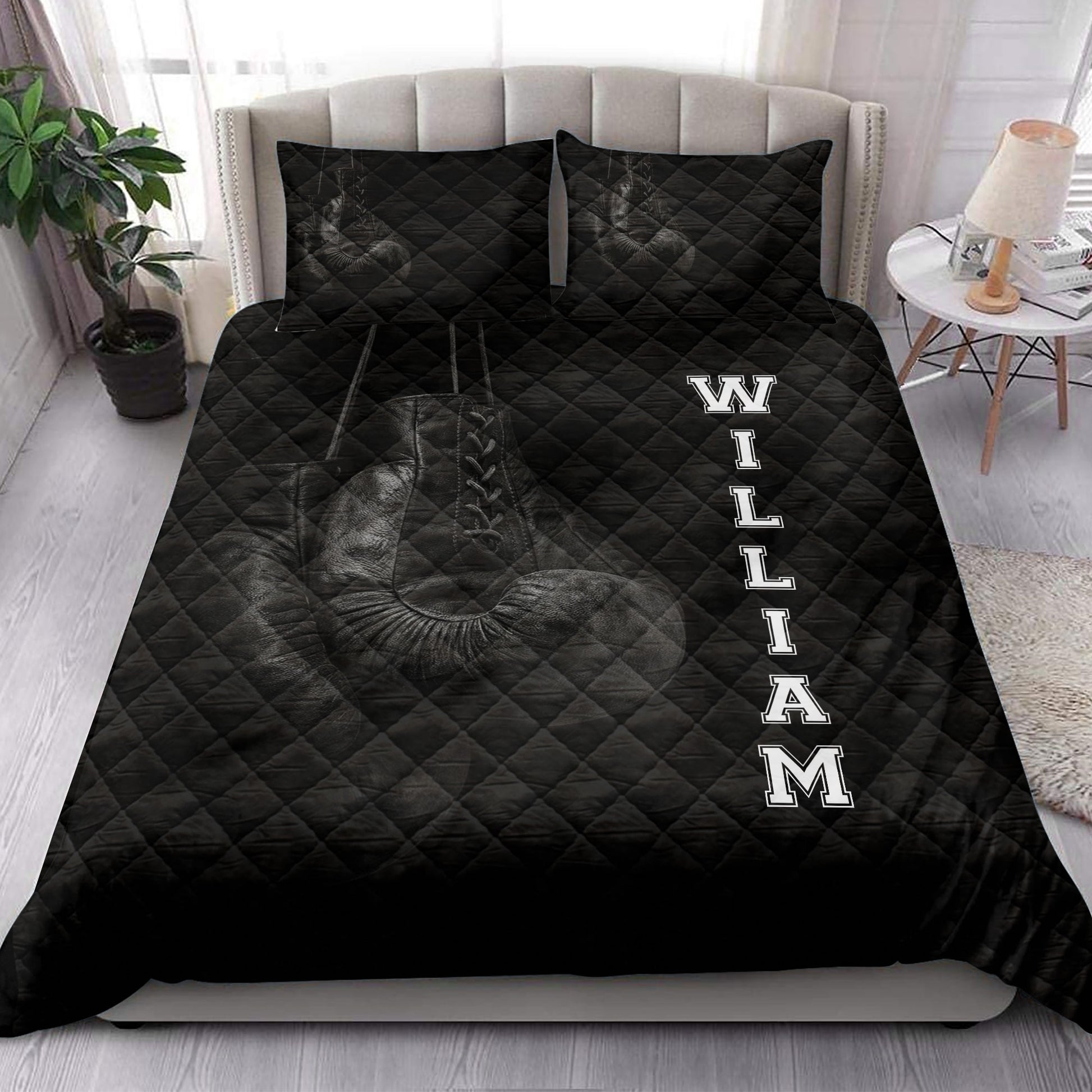 Boxing quilt bedding displayed in a bright bedroom with bold black sports artwork