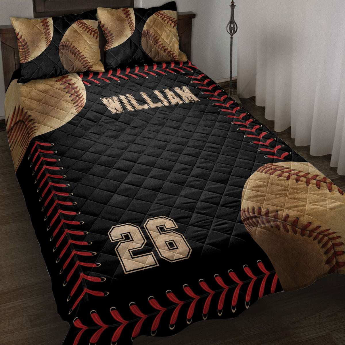 Black baseball quilt blanket displayed on a bed with baseball pillows, red stitching borders, and bold sports artwork