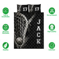 Lacrosse quilt bedding set shown front-facing with black sports artwork and illustrated stick, net, and ball