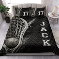 Lacrosse quilt blanket styled in a bright bedroom with black athletic artwork and lacrosse equipment imagery