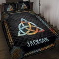 Wicca quilt blanket displayed on a bed with Celtic knot and mandala artwork