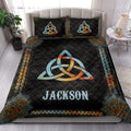 Wicca quilt blanket styled in a bright bedroom with Celtic knot artwork