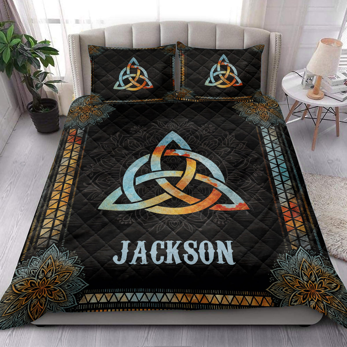Wicca quilt blanket styled in a bright bedroom with Celtic knot artwork
