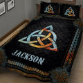 Close view of a black Wicca quilt blanket with Celtic knot and mandala designs