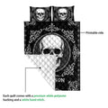 Skull quilt close-up showing the printed black front and contrasting quilted reverse side