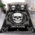 Gothic skull quilt blanket styled on a bedroom bed with matching skull pillow designs