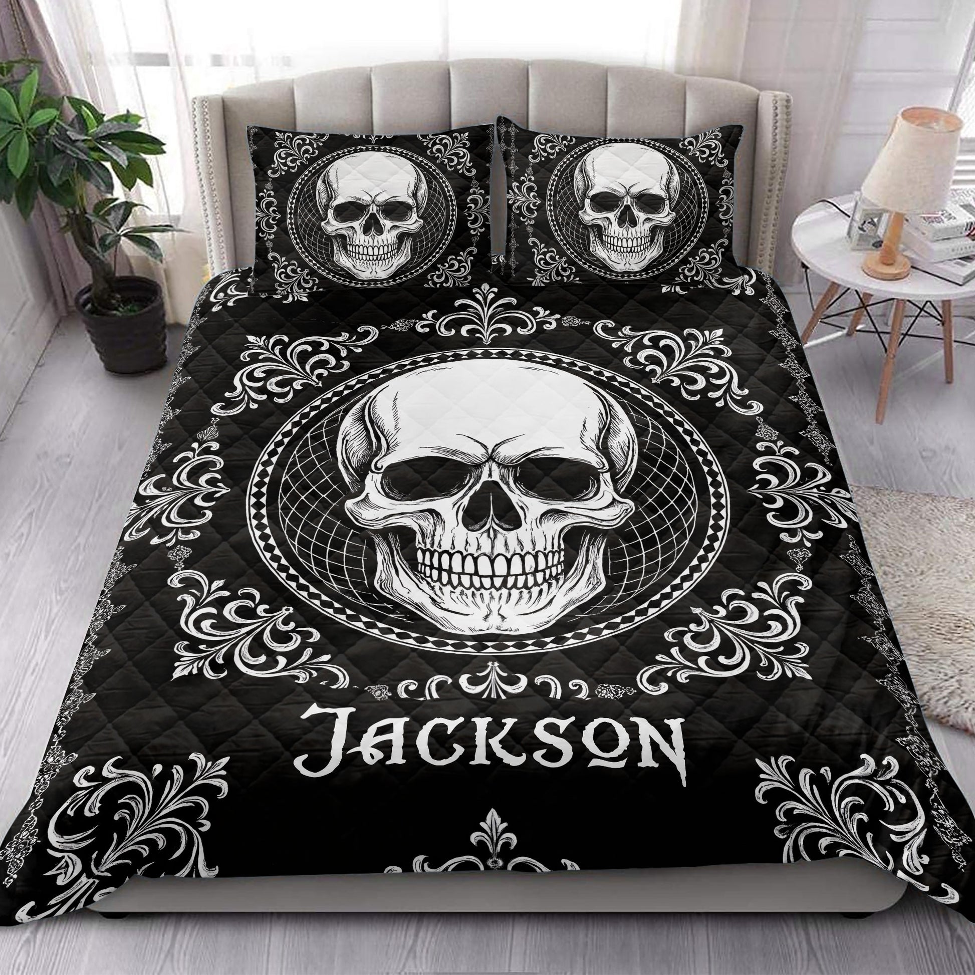Gothic skull quilt blanket styled on a bedroom bed with matching skull pillow designs